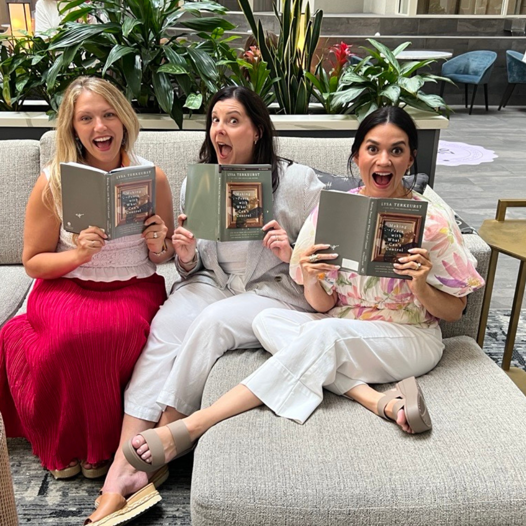 women interacting with Lysa TerKeurst's new book, Making Peace with What I Can't Control